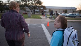 Stacy Ford taking her daughter, Aurora, who is 11 years old and has Down's Syndrome, to school on Tuesday, March 19, 2013.