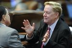 State Rep. Jim Pitts, R-Waxahachie, talks about HB 1 to a colleague on April 3, 2013.