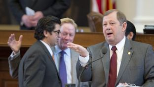 Statte Rep. John Otto, R-Dayton, explains an education funding amendment to SB 1 while House sponsor Chairman Jim Pitts, R-Waxahachie, talks with state Rep. Eddie Rodriguez, D-Austin, on April 4, 2013.