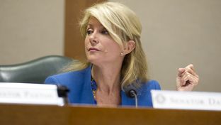 Sen. Wendy Davis, D-Fort Worth, listens after questioning Chairman Dan Patrick, R-Houston, on SB 23 in Senate Education Committee April 9, 2013.