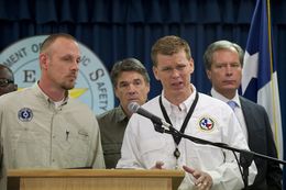 Chief of DPS Emergency Management Nim Kidd, r, answers a question on the West, TX explosion on April 18, 2013.  Left to right are TCEQ head Zac Covar, Gov. Rick Perry, Kidd and Lt. Gov. David Dewhurst.