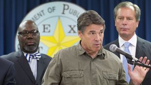 Flanked by Education Commissioner Michael Williams, l, and Lt. Gov. David Dewhurst, Gov. Rick Perry makes a statement on the West, TX disaster on April 18, 2013.