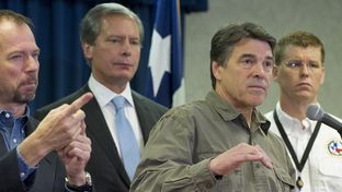 Gov. Rick Perry, r, answers a question on the West, TX disaster at DPS headquarters on April 18, 2013.