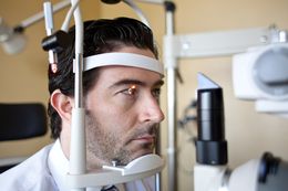 Dr. Susan Shauger performs a routine eye exam on Josh Fish at Lakeline Vision Source. A bill backed by optometrists to give them more negotiating power with health insurers, could force customers to lose discounts on services outside their insurance policy’s coverage.