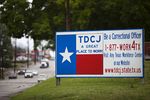 A sign outside of the Texas Department of Criminal Justice Headquarters in Huntsville. Last year, Texas prison officials approved a $3,000 bonus for correctional officers in units where a boom in oil and gas jobs has made it hard to find new hires. They are currently working with state lawmakers to grant all correctional officers a 5 percent pay increase.