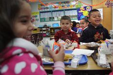 School children at Arnoldo Cantu Sr. Elementary School in San Juan, Texas, enjoy their free breakfast,  April 24, 2013.