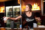 Lindsey Sunflower serves drinks at The Parish, a popular music venue in Austin, Texas. State Rep. Mark Strama is pursuing a bill that would cut the tax on mixed beverages charged to bars if they prove they are using the savings to present live music.