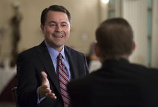 Evan Smith talks with Agriculture Commissioner Todd Staples during a TribLive event on May 2, 2013.