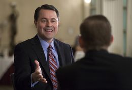 Evan Smith talks with Agriculture Commissioner Todd Staples during a TribLive event on May 2, 2013.
