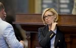 State Rep. Sarah Davis, R-Houston, waits to speak on HB 485 a concealed handgun license bill on May 4, 2013.