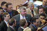 House sponsor State Rep. Allen Fletcher, R-Cypress, stands among House members during the consideration of a point of order on HB 972 a campus carry bill on May 4, 2013.