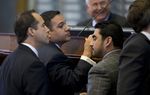 State Rep. Jason Villalba, R-Dallas, looks at Rep. Armando Walle, D-Houston, after Walle raised a point of order on HB 1009 on May 4, 2013.  The bill creating a school marshal program later passed to third reading.