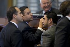 State Rep. Jason Villalba, R-Dallas, looks at Rep. Armando Walle, D-Houston, after Walle raised a point of order on HB 1009 on May 4, 2013.  The bill creating a school marshal program later passed to third reading.