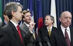 State Sen. Dan Patrick, l, D-Houston, expresses his support for Dr. Steven Hotze, M.D., r, in his lawsuit against the Affordable Care Act on May 7, 2013.