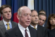 Surrounded by several Texas legislators, Dr. Steve Hotze announces his lawsuit targeting the Affordable Care Act on May 7, 2013.
