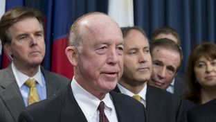 Surrounded by several Texas legislators, Dr. Steve Hotze announces his lawsuit targeting the Affordable Care Act on May 7, 2013.