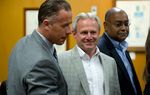 Michael Morton, at the Williamson County Courthouse on April 19, 2013, stands with state Sen. Rodney Ellis, D-Houston, an author of the Senate Bill 1611, and Ellis' chief of staff, Brandon Dudley, who also worked on the legislation.
