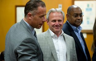 Michael Morton, at the Williamson County Courthouse on April 19, 2013, stands with state Sen. Rodney Ellis, D-Houston, an author of the Senate Bill 1611, and Ellis' chief of staff, Brandon Dudley, who also worked on the legislation.