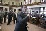 Gov. Rick Perry leaves the House chamber after speaking and visiting with members on May 13, 2013.