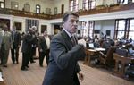 Gov. Rick Perry leaves the House chamber after speaking and visiting with members on May 13, 2013.