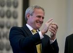 Michael Morton cheers the unanimous passage of SB 825 in the Texas House on May 13, 2013.