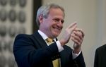 Michael Morton cheers the unanimous passage of SB 825 in the Texas House on May 13, 2013.