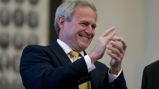 Michael Morton cheers the unanimous passage of SB 825 in the Texas House on May 13, 2013.