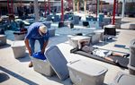 Lee Ingram, of Jacksonville, Florida, sorts through his belongings at Prospects Courtyard, an outdoor sleeping area for homeless men and women. Ingram said he left Florida after a divorce and is staying at Haven for Hope until he finds a stable job.