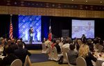 Small business owner Reynaldo Gutierrez of Houston, stands to ask a question of Gov. Rick Perry at a speech on May 22, 2013 at the Austin Hilton.