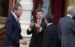 Lt. Gov. David Dewhurst, l, Gov. Rick Perry and House Speaker Joe Straus confer after the Texas Fallen Heroes Memorial Ceremony on May 25, 2013.