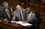 State Reps, l to r, Drew Darby, R-San Angelo, Jim Pitts, R-Waxahachie, Sylvester Turner, D-Houston and Dawnna Dukes, D-Austin look at HB1025 on the House floor on May 26, 2013.