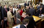 The Republican caucus meets in the Speaker's Committee Room before votes on budget bills on May 26, 2013.
