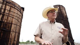 Landowner Stuart Carter, in Central Texas near the town of Luling, has years of abandoned oil equipment on his property. Here, two oil wooden oil tanks that he says date to the 1920s.