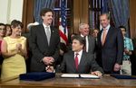 Gov. Rick Perry smiles after signing HB 5 the education reform bill before a crowd in the Governor's Reception Room on June 10, 2013. Left to right are Sens. Donna Campbell, R-New Braunfels, Dan Patrick, R-Houston, Rep. Jimmie Don Aycock, R-Killeen and Lt. Gov. David Dewhurst.