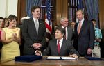 Gov. Rick Perry smiles after signing HB 5 the education reform bill before a crowd in the Governor's Reception Room on June 10, 2013. Left to right are Sens. Donna Campbell, R-New Braunfels, Dan Patrick, R-Houston, Rep. Jimmie Don Aycock, R-Killeen and Lt. Gov. David Dewhurst.