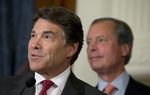 Governor Rick Perry and Lt. Gov. David Dewhurst answer questions from the media after a series of education bill signings on June 10, 2013.