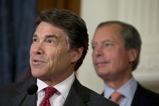 Governor Rick Perry and Lt. Gov. David Dewhurst answer questions from the media after a series of education bill signings on June 10, 2013.