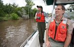 Professor Kirk Winemiller of the Texas A&M Department of Wildlife and Fisheries, right, and Jalyn Cummings National Park Service, Chief of Resource mnagment  at Big Thicket National Preserve on a bayou along the Neches River near Beaumont, Texas Friday, May 30, 2013.