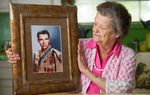 Nadene Lokey with a photo of her brother, WWII hero Audie Murphy, at her home in Farmersville, Texas on June 17, 2013.