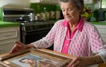 Nadene Lokey with a photo of her brother, WWII hero Audie Murphy, at her home in Farmersville, Texas on June 17, 2013.