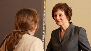 Susan Combs, Texas Comptroller of Public Accounts, speaks with a member of the audience during TribLive, a monthly conversation with public officials held by the Texas Tribune.