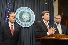 Gov. Rick Perry speaks to the media about his legislative proirities as Lt. Gov. David Dewhurst (l) and House Speaker Joe Straus (r) listen on January 9, 2013.