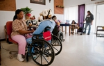 Austin State-Supported Living Center employee Tamika Mays with resident Rebecca Hadnot.