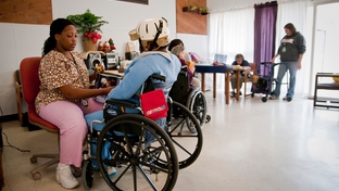 Austin State-Supported Living Center employee Tamika Mays with resident Rebecca Hadnot.