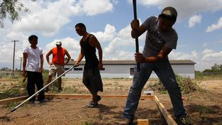 Juvenile detainees work on a new juvenile detention village in Eagle Pass. Maverick County has been taking donations for the new facility, which is being built, in part, by county employees who sacrifice their own time for the project.