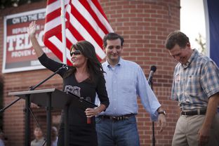 Republican primary candidate Ted Cruz, center, is joined on stage by Sarah Palin, left, and Senator Jim DeMint, right, at a rally in The Woodlands, Texas, on Friday July 27, 2012.