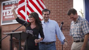 Republican primary candidate Ted Cruz, center, is joined on stage by Sarah Palin, left, and Senator Jim DeMint, right, at a rally in The Woodlands, Texas, on Friday July 27, 2012.