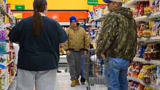 East Texas residents shop in a grocery store.