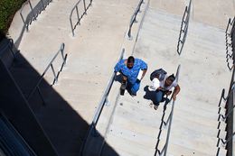 Students walking between buildings at Austin Community College - Eastview Campus.