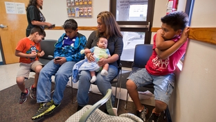 Rosario Espriella (center) waits for her appointment at the Edinburg, Texas Planned Parenthood clinic on Tuesday, February 14 with her children L to R:  Edgar, 6, Eduardo, 12, Diego, 2 months and Victor, 10.